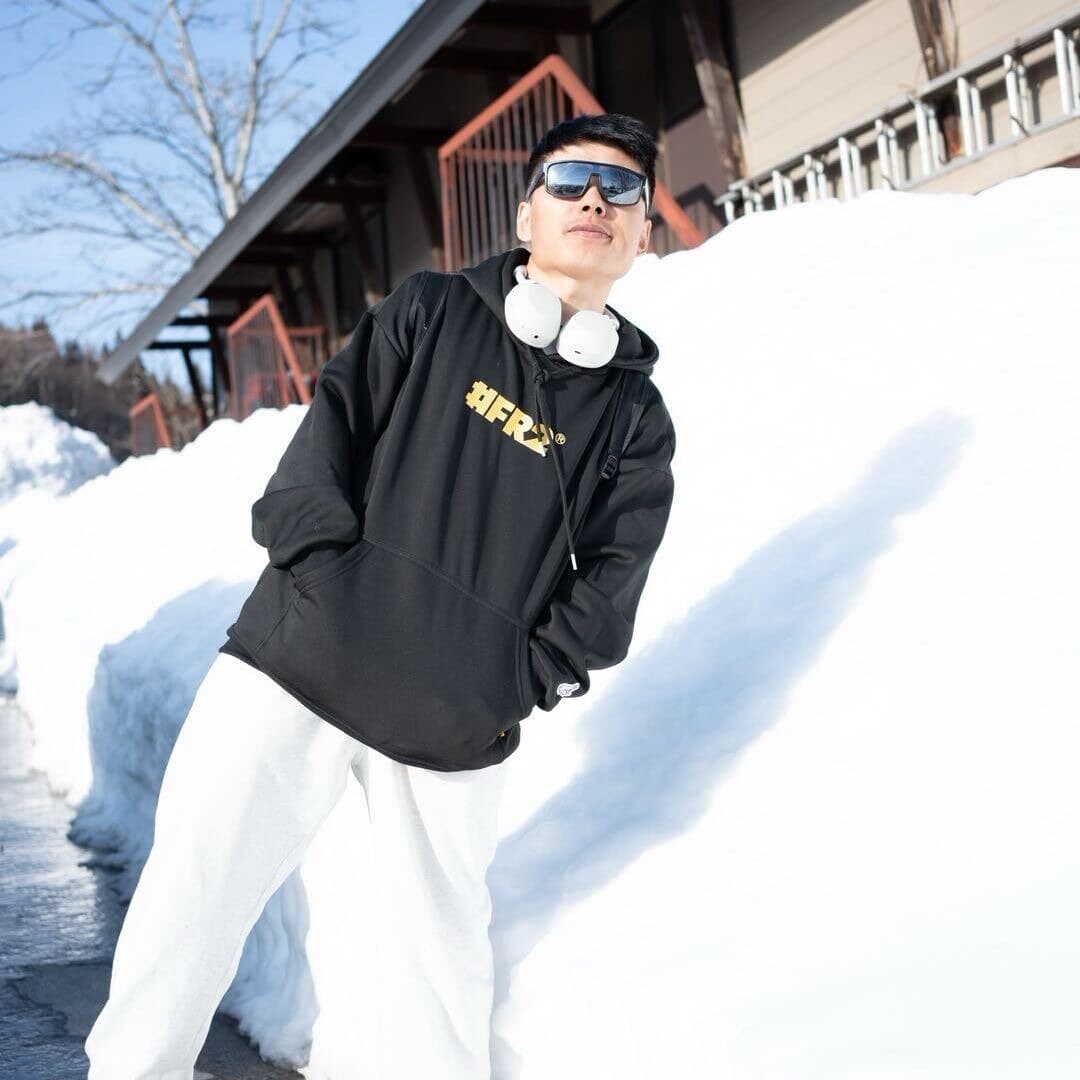 Guest standing beside a high snowbank
