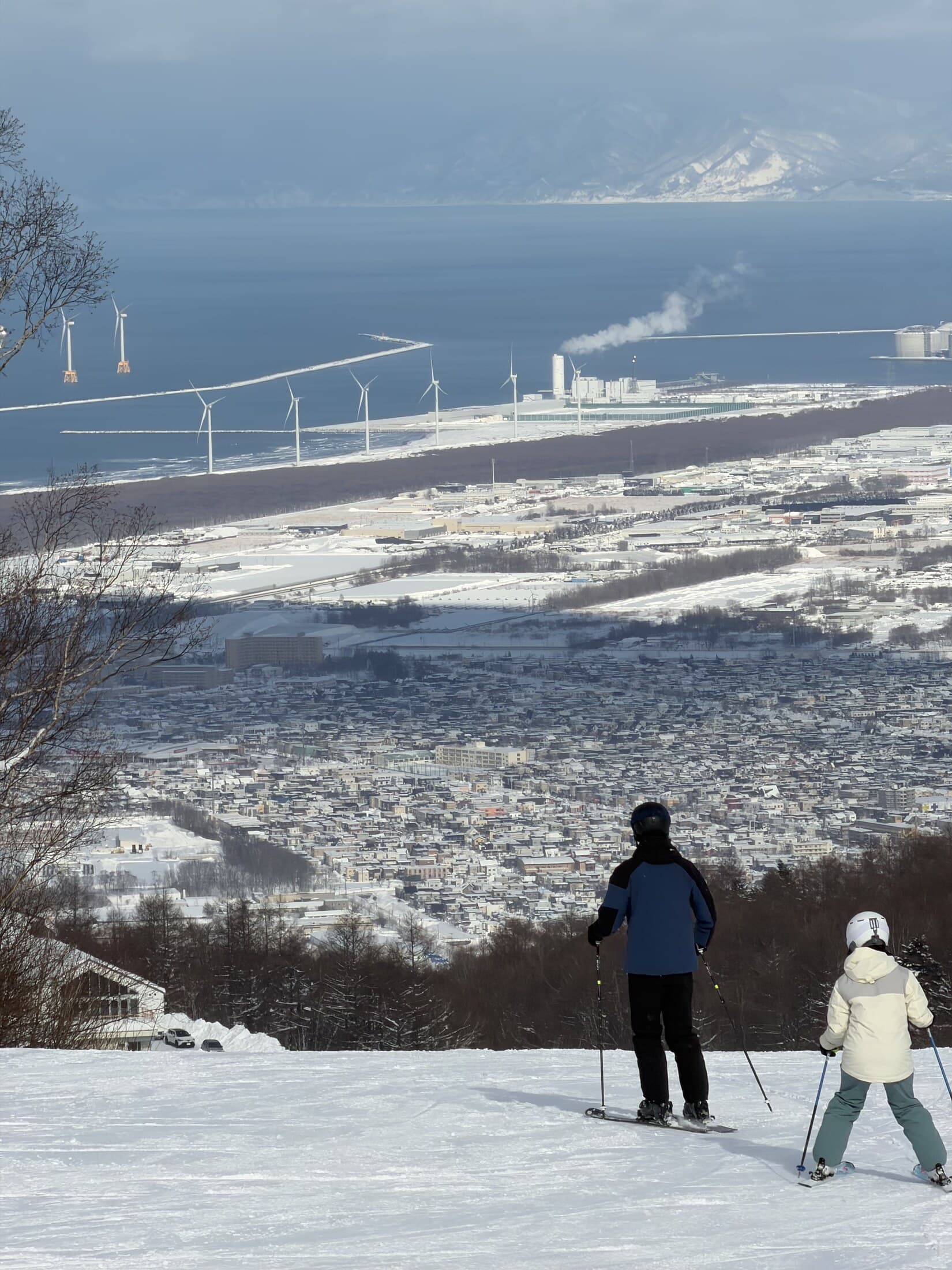 Skiers above the Hokkaido coast