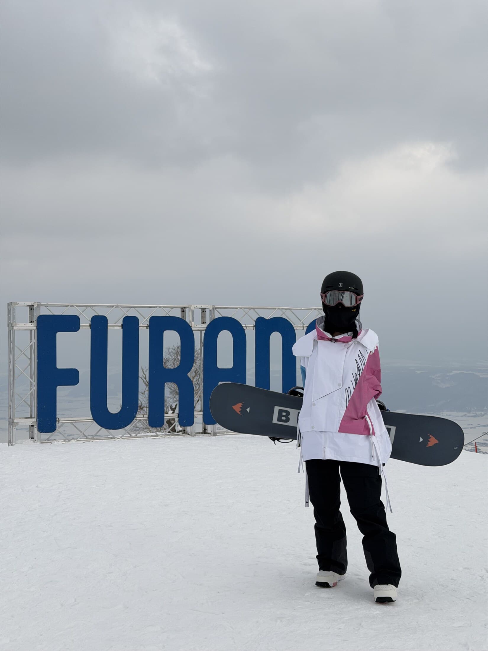 Snowboards with the Furano slopes behind